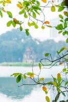 Hoan Kiem Lake - Ho Guom or Sword lake in the center of Hanoi in the fog in the morning. photo