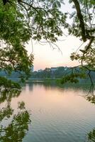 Hoan Kiem Lake - Ho Guom or Sword lake in the center of Hanoi in the fog in the morning. photo