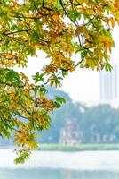 Hoan Kiem Lake - Ho Guom or Sword lake in the center of Hanoi in the fog in the morning. photo