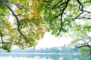 Hoan Kiem Lake - Ho Guom or Sword lake in the center of Hanoi in the fog in the morning. photo