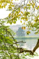 Hoan Kiem Lake - Ho Guom or Sword lake in the center of Hanoi in the fog in the morning. photo