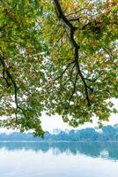 Hoan Kiem Lake - Ho Guom or Sword lake in the center of Hanoi in the fog in the morning. photo