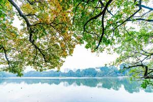 Hoan Kiem Lake - Ho Guom or Sword lake in the center of Hanoi in the fog in the morning. photo