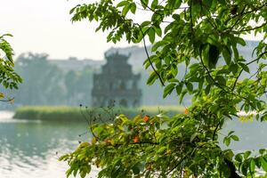 Hoan Kiem Lake - Ho Guom or Sword lake in the center of Hanoi in the fog in the morning. photo