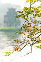 Hoan Kiem Lake - Ho Guom or Sword lake in the center of Hanoi in the fog in the morning. photo