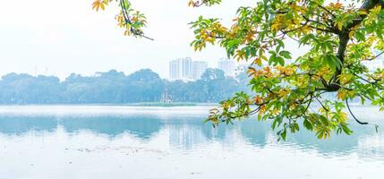 Hoan Kiem Lake - Ho Guom or Sword lake in the center of Hanoi in the fog in the morning. photo