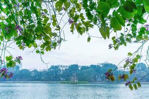 Hoan Kiem Lake - Ho Guom or Sword lake in the center of Hanoi in the fog in the morning. photo