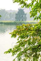 Hoan Kiem Lake - Ho Guom or Sword lake in the center of Hanoi in the fog in the morning. photo