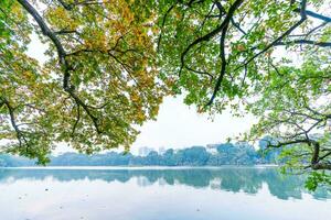 Hoan Kiem Lake - Ho Guom or Sword lake in the center of Hanoi in the fog in the morning. photo