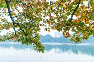 Hoan Kiem Lake - Ho Guom or Sword lake in the center of Hanoi in the fog in the morning. photo