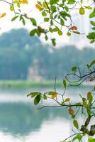 Hoan Kiem Lake - Ho Guom or Sword lake in the center of Hanoi in the fog in the morning. photo