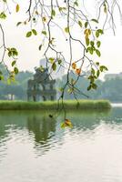 Hoan Kiem Lake - Ho Guom or Sword lake in the center of Hanoi in the fog in the morning. photo