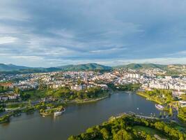 Aerial panorama view of Sunflower Building at Lam Vien Square in Da Lat City. Tourist city in developed Vietnam. Center Square of Da Lat city with Xuan Huong lake photo