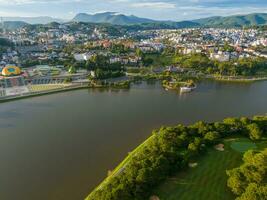 Aerial panorama view of Sunflower Building at Lam Vien Square in Da Lat City. Tourist city in developed Vietnam. Center Square of Da Lat city with Xuan Huong lake photo