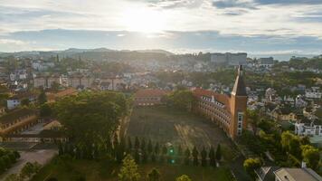 Aerial view of Da Lat Pedagogical College in the city of Da Lat near Xuan Huong lake in the morning. Tourist city in developed Vietnam photo