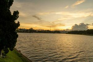 Sunset view of a Da Lat City with development buildings, transportation, market. Tourist city with center square of Da Lat city near Xuan Huong lake photo