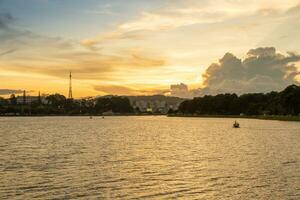 Sunset view of a Da Lat City with development buildings, transportation, market. Tourist city with center square of Da Lat city near Xuan Huong lake photo