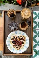 Cold milk coffee cups in Da Lat city, Vietnam style on table. Selective Focus. photo