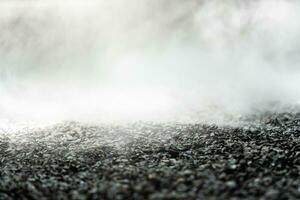 gravel texture floor with mist or fog. Light, dark and gray abstract gravel texture for display products photo