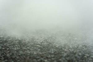 gravel texture floor with mist or fog. Light, dark and gray abstract gravel texture for display products photo