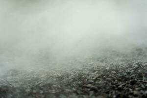 gravel texture floor with mist or fog. Light, dark and gray abstract gravel texture for display products photo