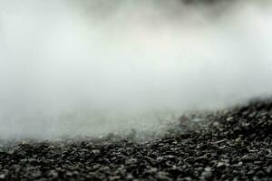 gravel texture floor with mist or fog. Light, dark and gray abstract gravel texture for display products photo