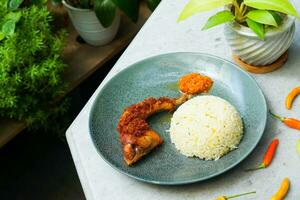 fried chicken with rice and chili photo