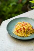 pasta spaghetti in plate and white table photo