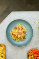 pasta spaghetti in plate and white table photo