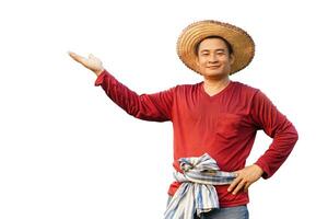 Handsome Asian man farmer, wears hat, red shirt, put hand on waist, shows hand to present. Feels confident. Concept, agriculture occupation. photo