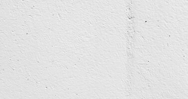 Blank concrete white rough wall for background. Beautiful white wall surface background pattern. photo