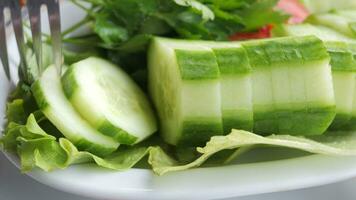 close up of slice of cucumber in a bowl on table video