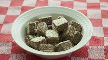 closeup of cube shape wafer chocolate in a bowl video