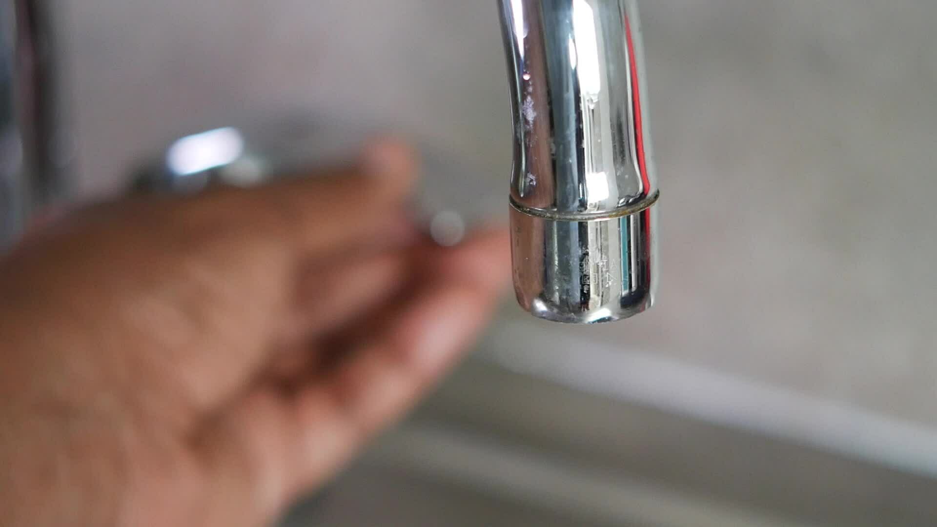 water pouring from a faucet tap slow motion 34987509 Stock Video at