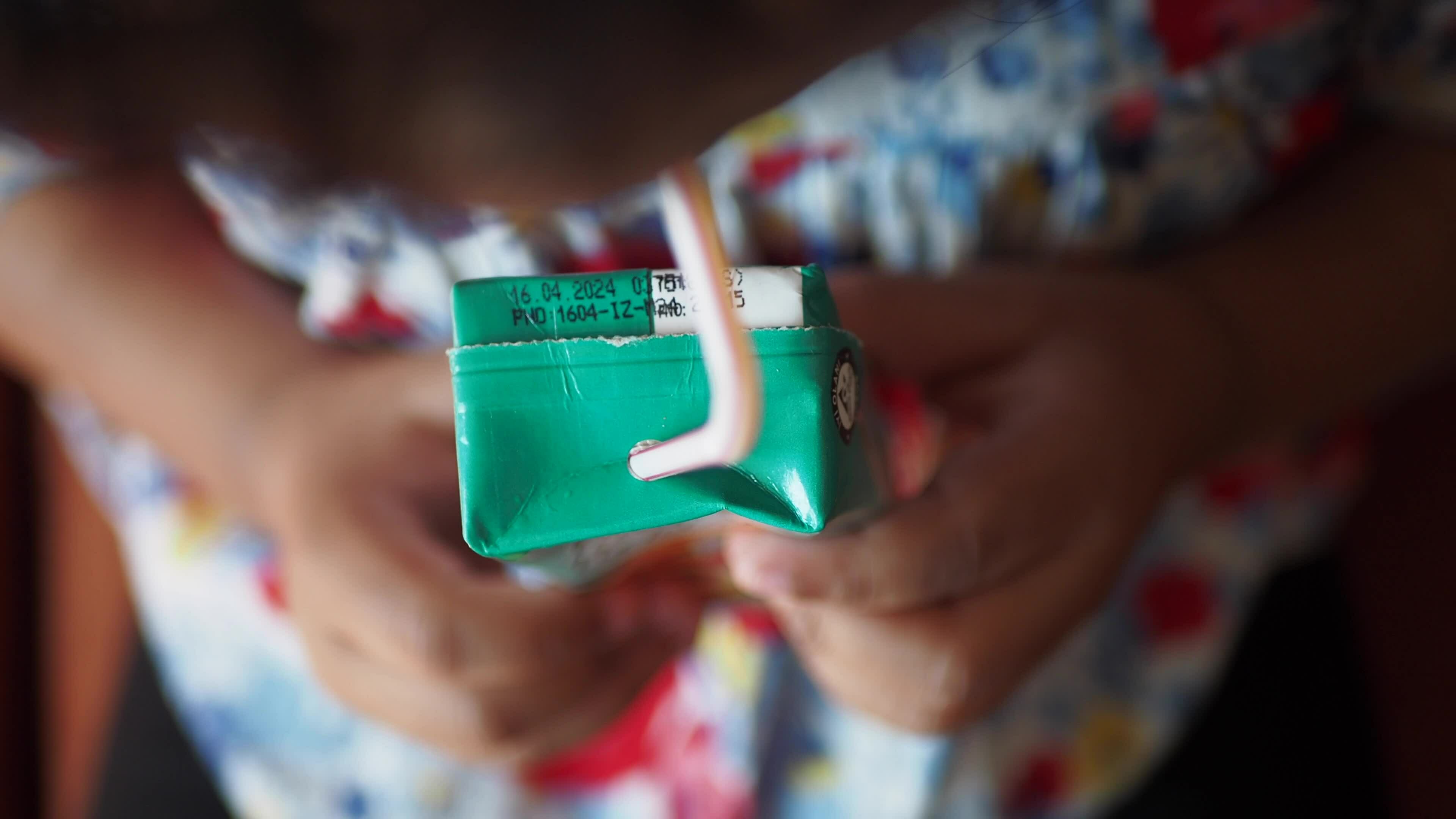 child drinking juice box top view 34987526 Stock Video at Vecteezy
