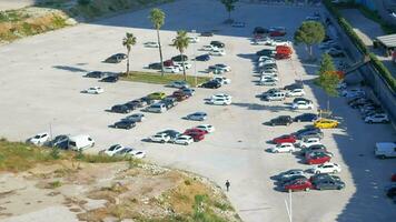 turkey istanbul 12 june 2023. top view of cars parking in outdoor parking area in bright sunny day. video