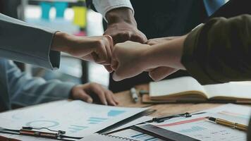 Real estate agent and customers shaking hands together celebrating finished contract after about home insurance and investment loan, handshake and successful deal. video