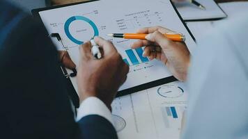 Business team collaboration discussing working analyzing with financial data and marketing growth report graph in team, presentation and brainstorming to strategy planning making profit of company. video