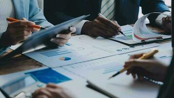 Business team collaboration discussing working analyzing with financial data and marketing growth report graph in team, presentation and brainstorming to strategy planning making profit of company. video