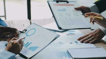 Business team collaboration discussing working analyzing with financial data and marketing growth report graph in team, presentation and brainstorming to strategy planning making profit of company. video