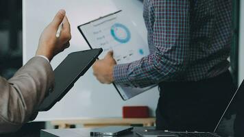 Business team collaboration discussing working analyzing with financial data and marketing growth report graph in team, presentation and brainstorming to strategy planning making profit of company. video