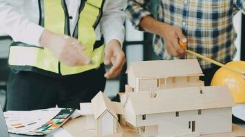 Homeowners and foreman signing contract at construction site video