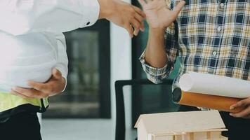 Homeowners and foreman signing contract at construction site video