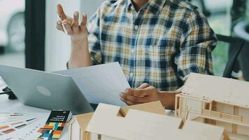 Homeowners and foreman signing contract at construction site video