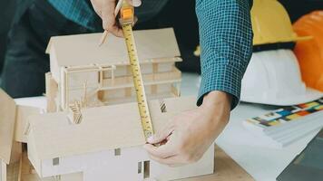 Homeowners and foreman signing contract at construction site video