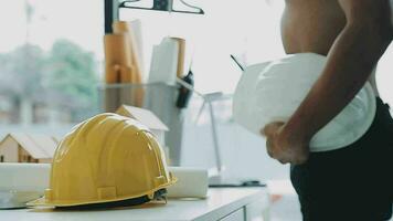 Homeowners and foreman signing contract at construction site video