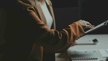 Business team meeting present, investor colleagues consultation and conference new strategy plan business and market growth on financial document graph report, Meeting and Talking. video
