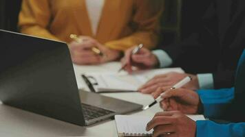 Business team meeting present, investor colleagues consultation and conference new strategy plan business and market growth on financial document graph report, Meeting and Talking. video