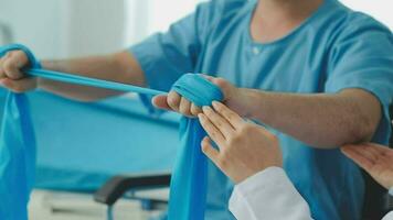 Physiotherapist instructing the patient during exercise video