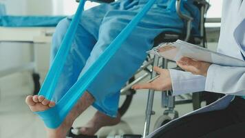 Physiotherapist instructing the patient during exercise video